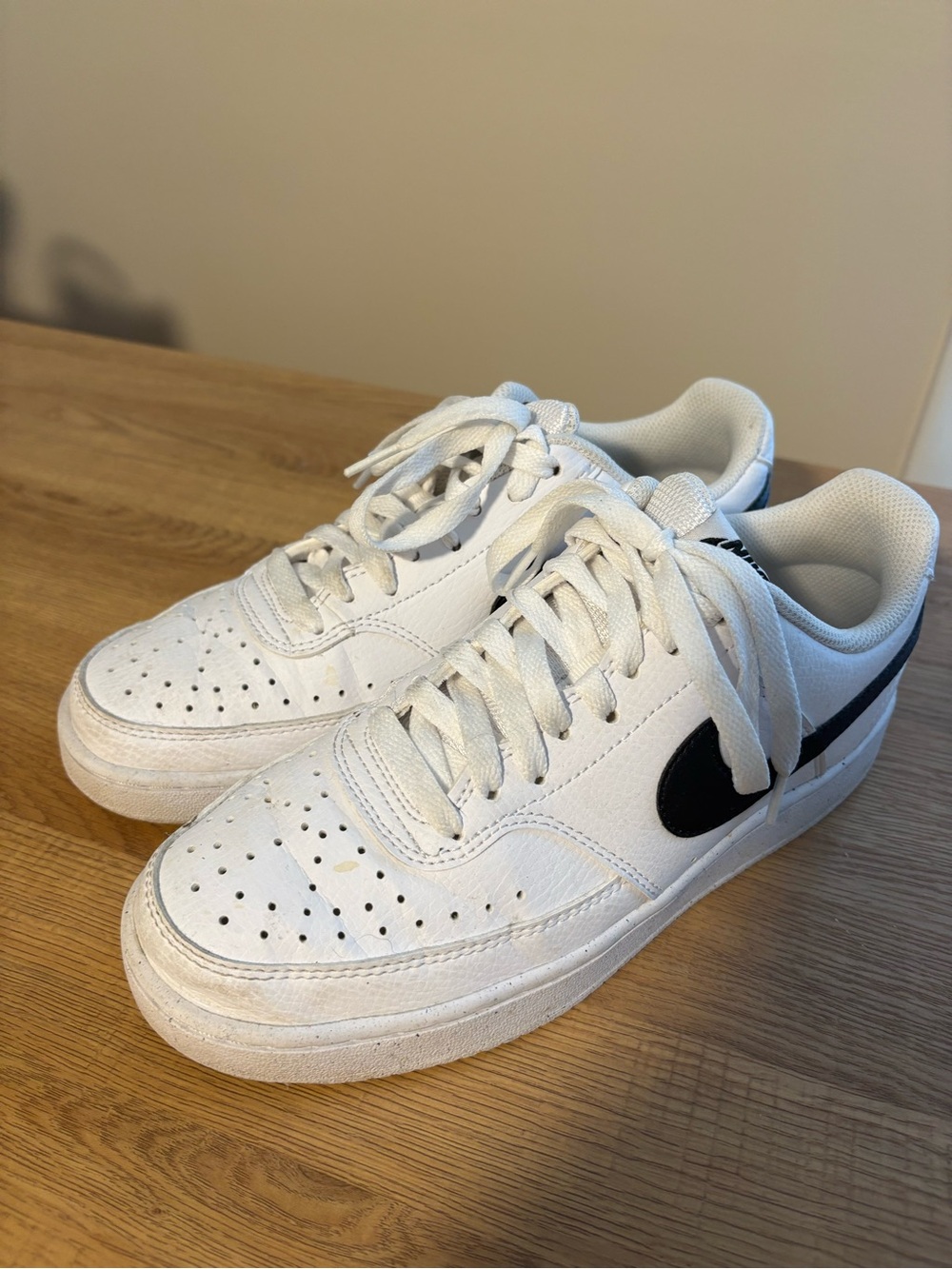 Nike White Low-Top Sneakers with Black Swoosh